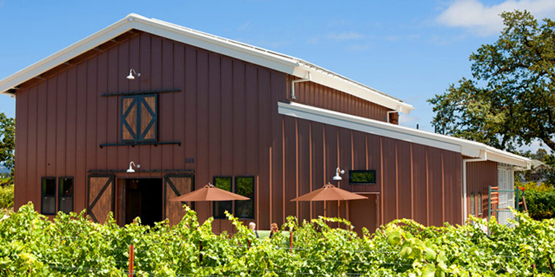 Inman Family Wine exterior featuring classic horse stable architecture.
