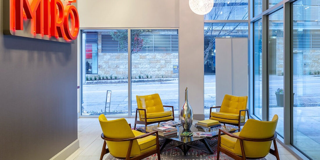 The casual gathering space at Miro with comfortable seating, stylish decor, and warm lighting, creates an inviting area for socializing and relaxation.