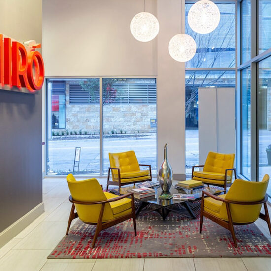 The casual gathering space at Miro with comfortable seating, stylish decor, and warm lighting, creates an inviting area for socializing and relaxation.
