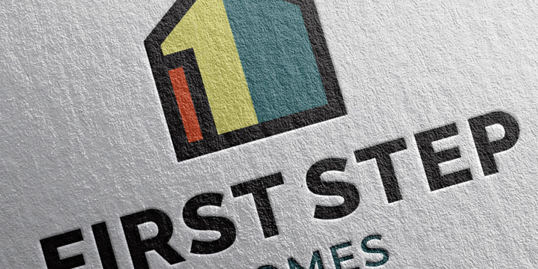 The First Step Homes logo is embossed on letterhead, adding a tactile and professional touch to the stationery design.