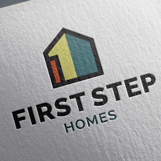 The First Step Homes logo is embossed on letterhead, adding a tactile and professional touch to the stationery design.