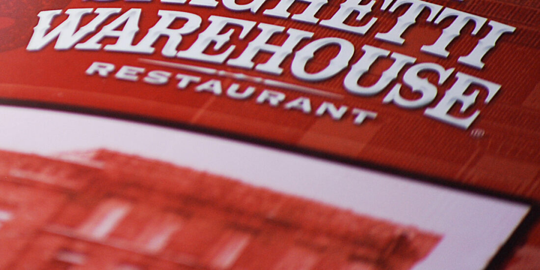 Spaghetti Warehouse menu cover detail photograph featuring a sophisticated typographic treatment.